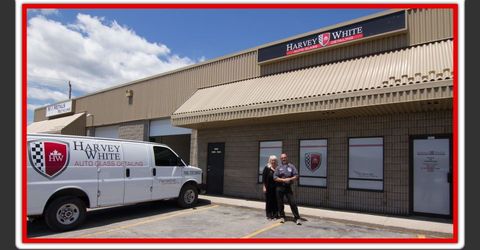 Harvey and Lisa in front of Harvey White Auto Glass